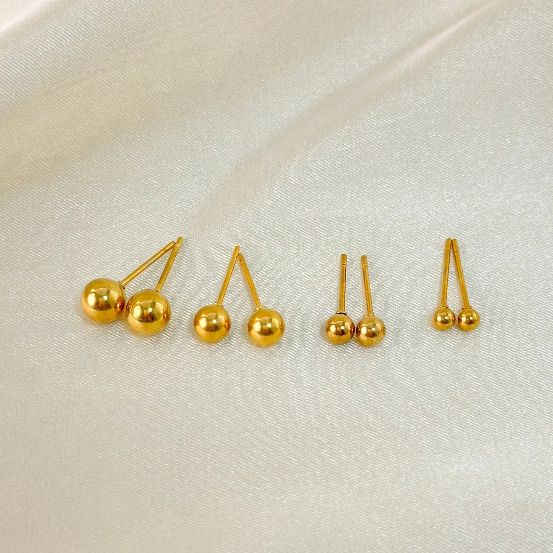 Minimalist 18K gold plated titanium steel ball stud earrings in 3mm, 4mm, 5mm, and 6mm sizes for women.