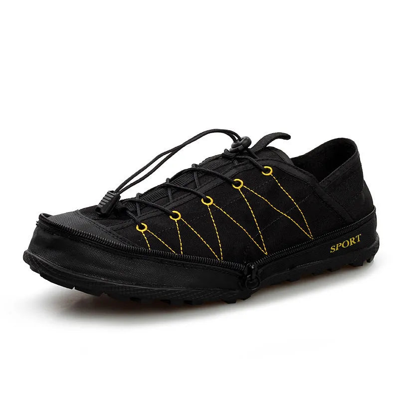Orange portable folding outdoor shoe with side zipper and mesh upper on a grey background