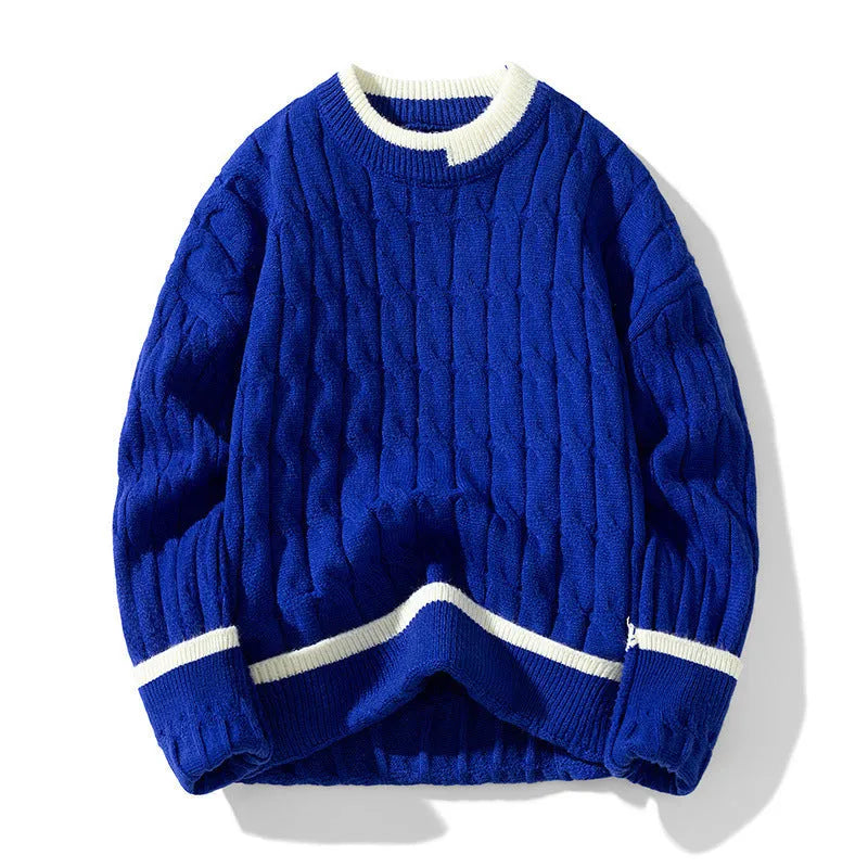 Man wearing a loose-fit, light blue, long sleeve two-piece acrylic sweater set