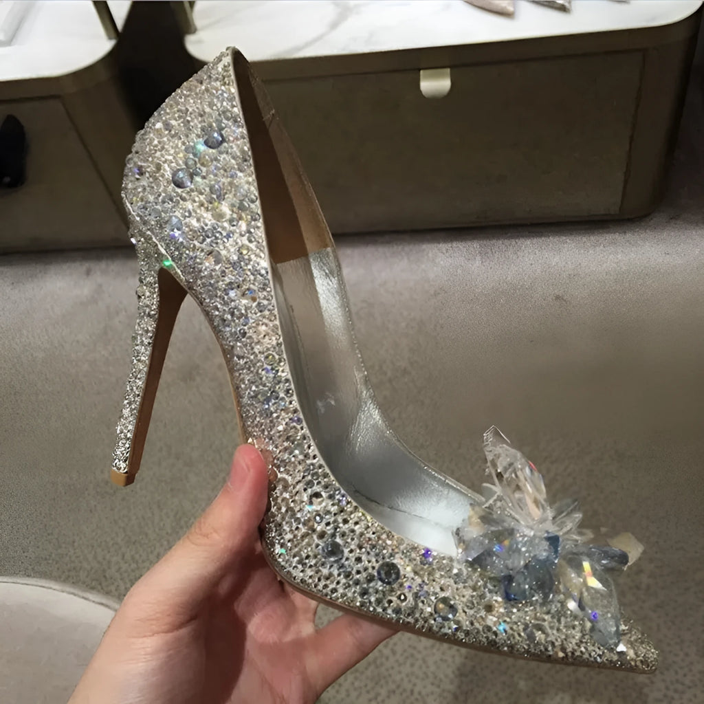 Women's gold high heel shoes with rhinestone detailing and pointed toe design