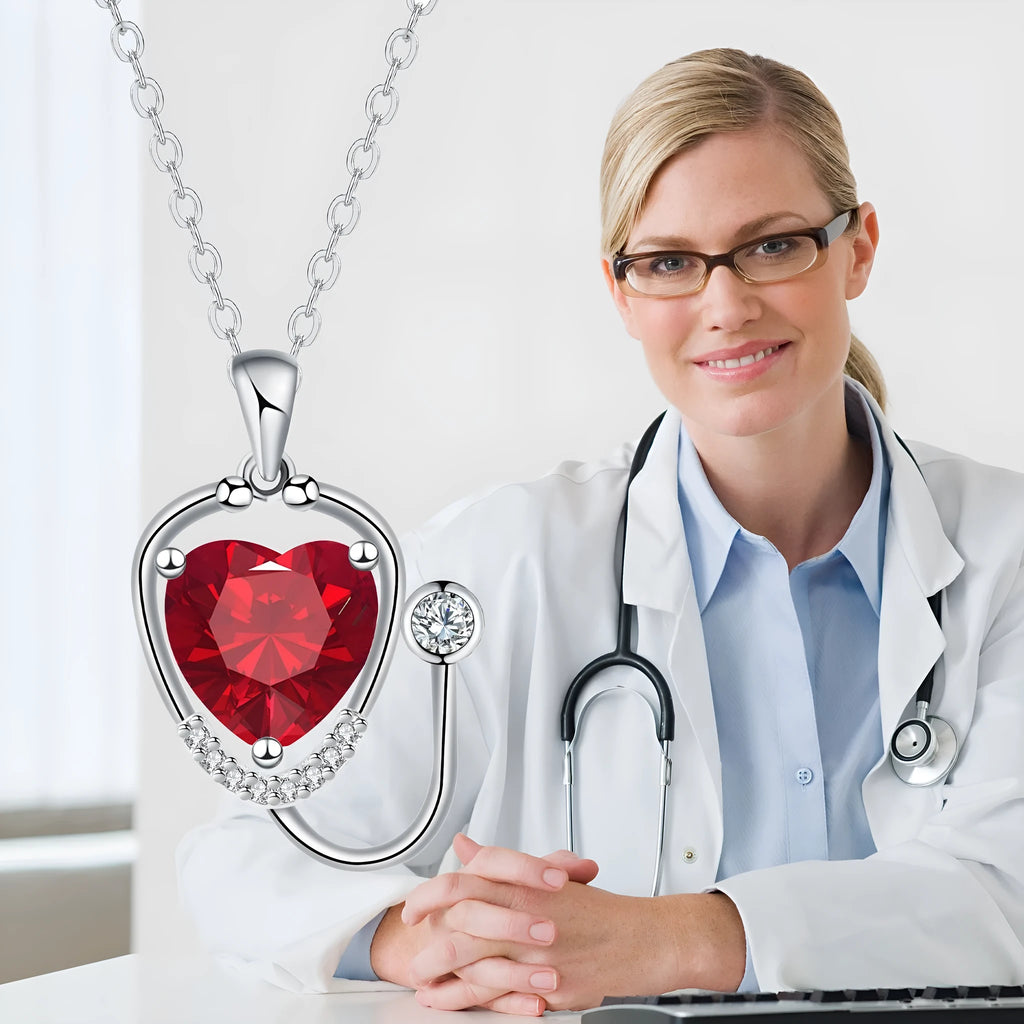 Women's copper electroplated stethoscope wings cross necklace in red diamond colour