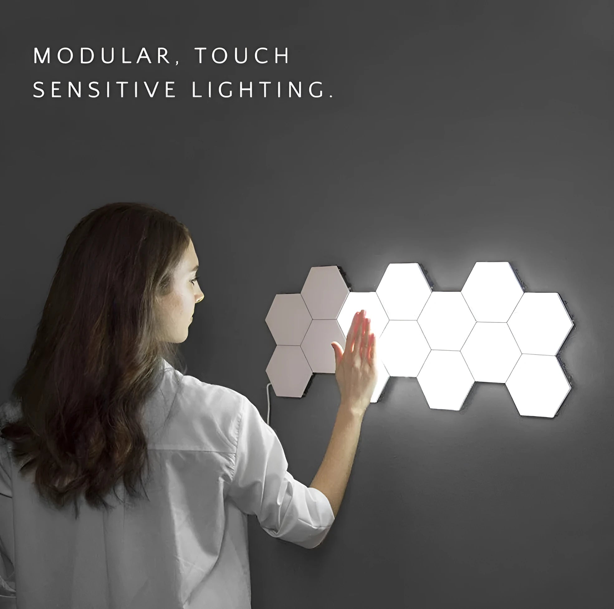 Helios modular honeycomb wall lamp panels assembled in pattern with touch-activated LED lighting
