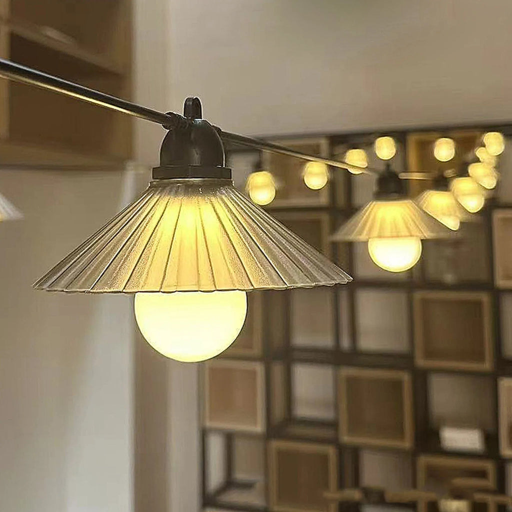 Outdoor flower-shaped LED string lights with IP65 rating hung in a garden setting.