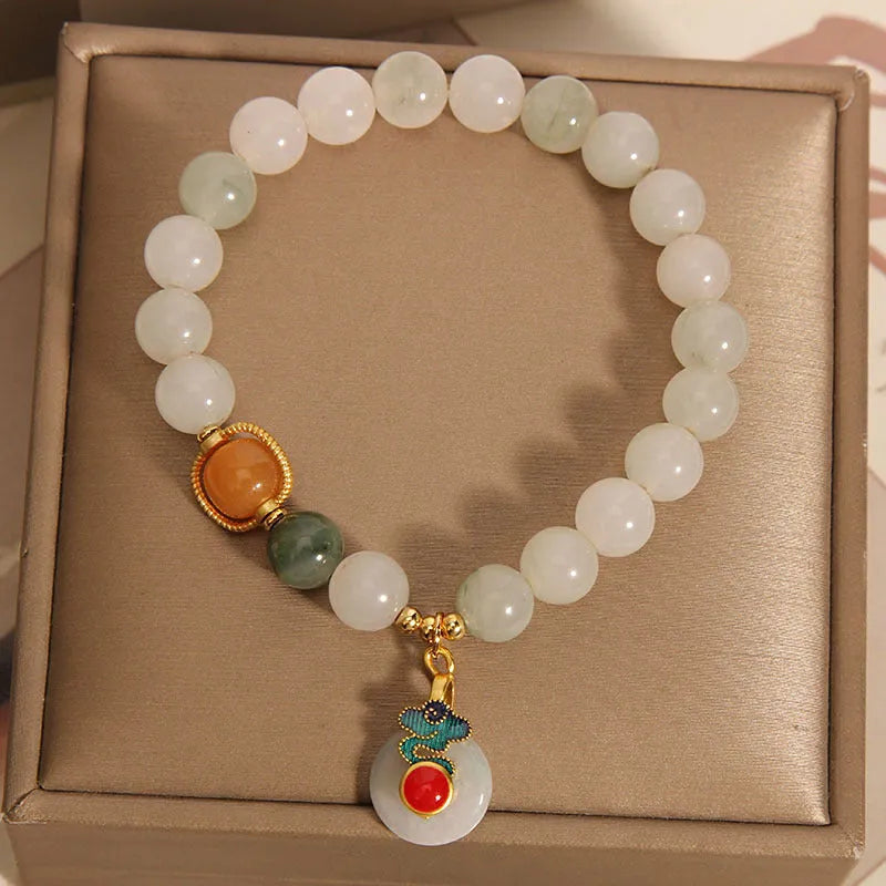 Women's ice jade bracelet with pearl accents and traditional Xiangyun peace buckle closure