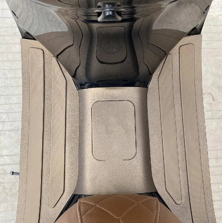 Motorcycle front foot pad accessory with 3D rubber texture in black grey and bronze gold colours