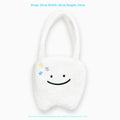 White plush shoulder tote bag with large tooth design and crossbody strap