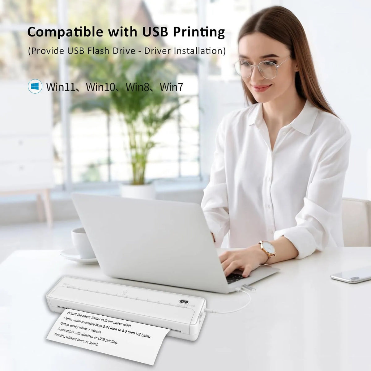 X8 black portable A4 Bluetooth printer on a desk next to a mobile phone.