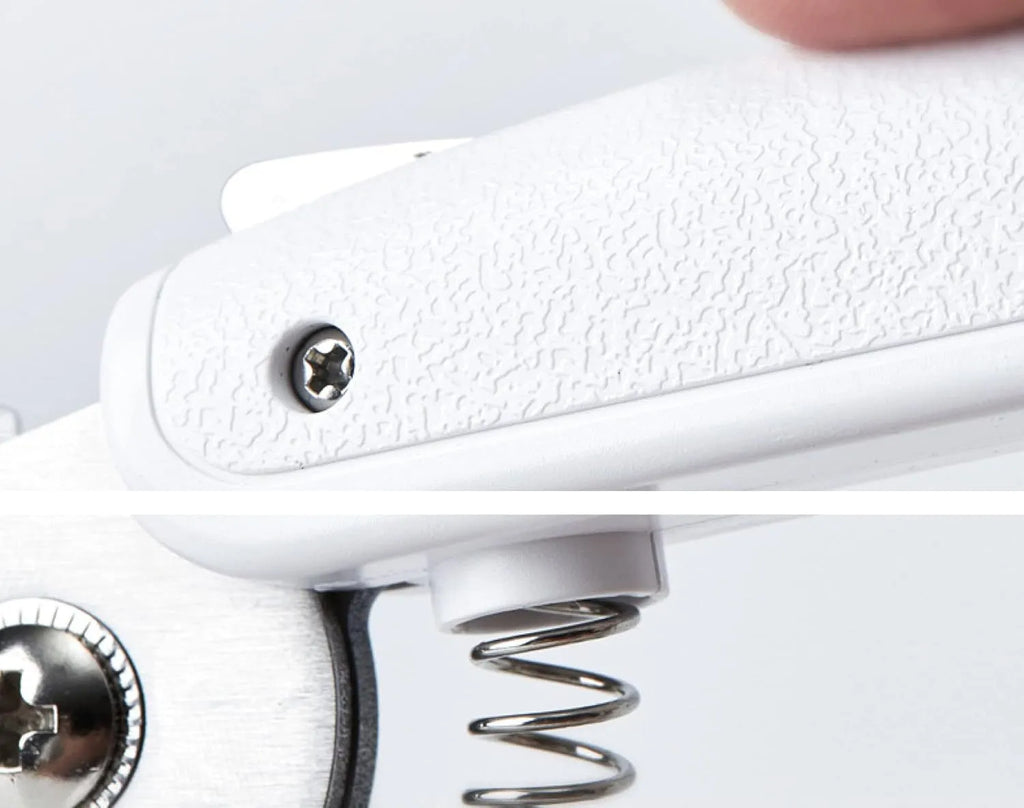 White pet nail clippers with LED light, transparent guard, and leather-like handle next to a nail file.