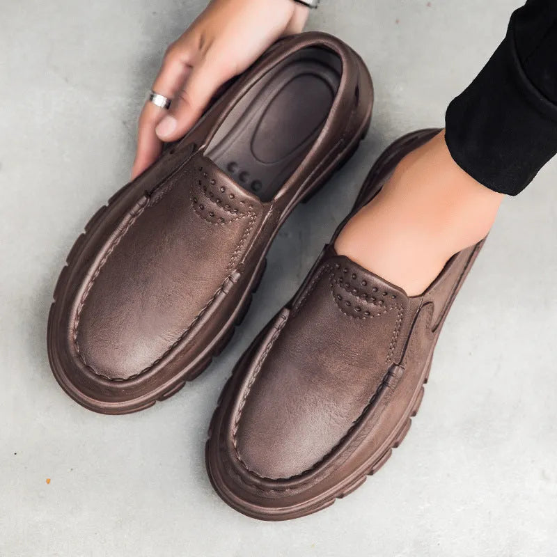 Men's black slip-on casual shoes with a round toe and chunky waterproof platform sole.
