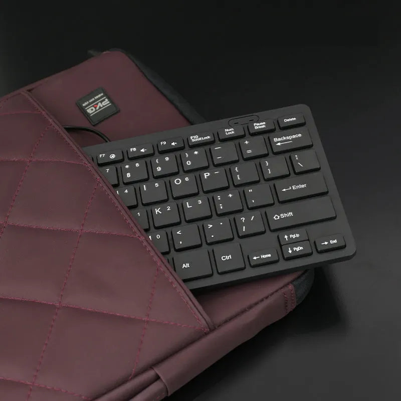 USB wired mini keyboard in black, white, pink, and blue colours with compact design