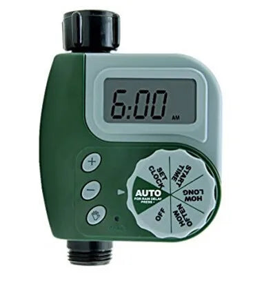 Green digital garden hose timer with large display and dial for automatic sprinkler programming