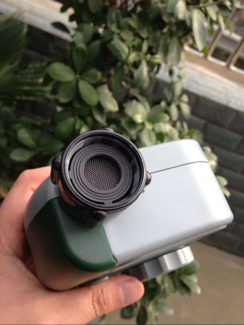 Green digital garden hose timer with large display and dial for automatic sprinkler programming