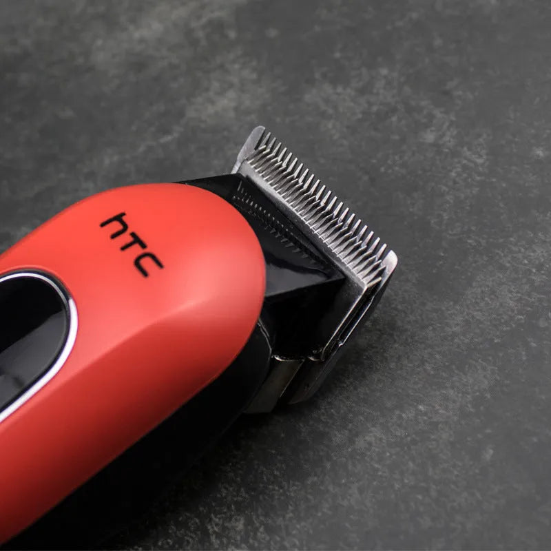 Professional digital electric hair clipper in black, red, or white with four attachment combs, cleaning brush, and lubricating oil.