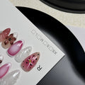 Hand-painted three-dimensional nail art patches with embossed candy patterns in almond shapes