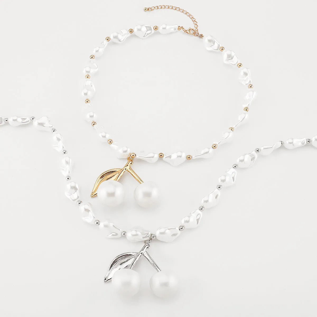Alloy imitation pearl necklace with irregular geometric cherry fruit pendant on pearl chain