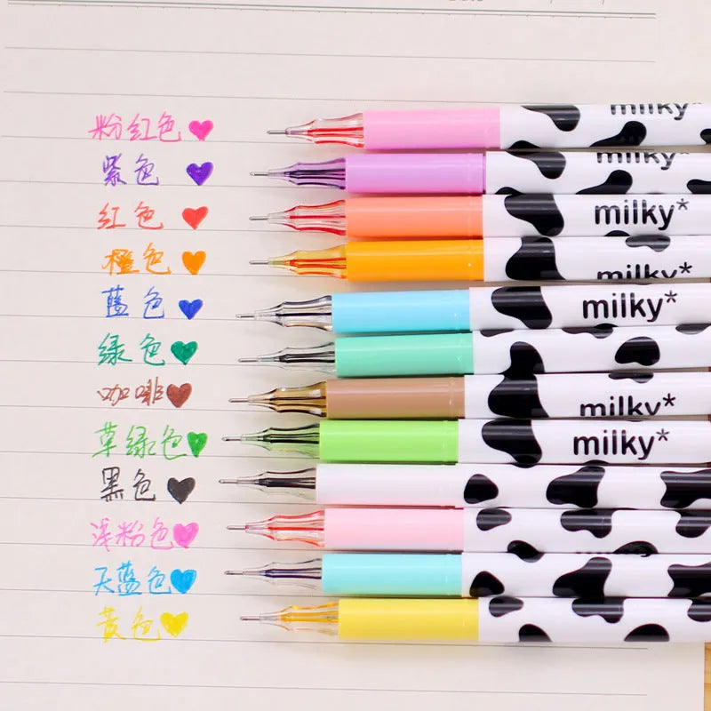 Box of twelve cow print patterned gel pens with 0.38mm fine tips in assorted colours.