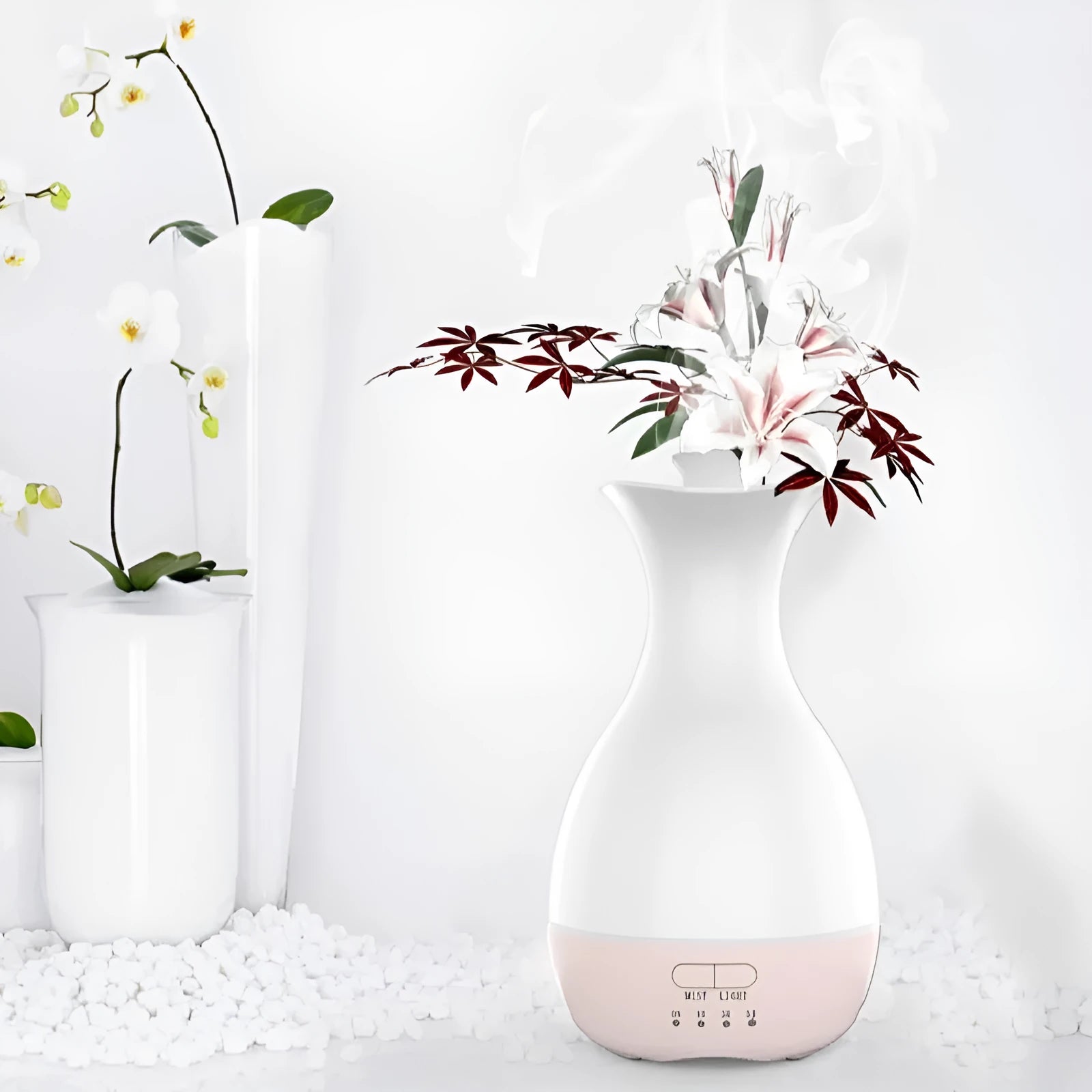 White or pink ceramic ultrasonic air humidifier and essential oil diffuser with colourful night light, 200ml capacity.