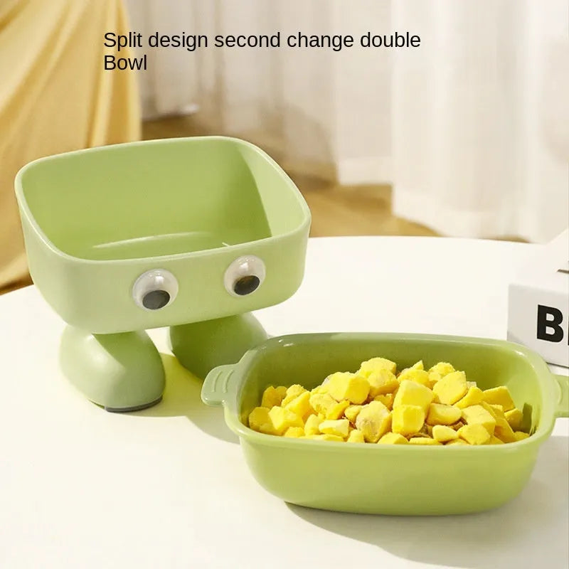 Green robot-shaped elevated cat bowl with tilted design and non-slip base