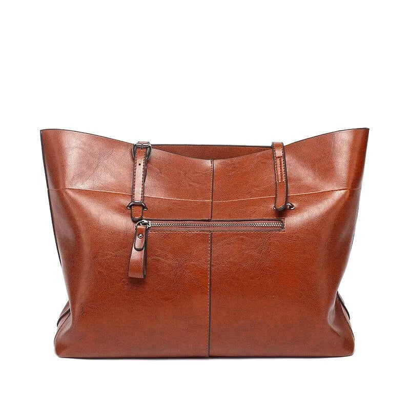 Waxed cowhide leather handbag showing horizontal cross-section opening and internal compartments
