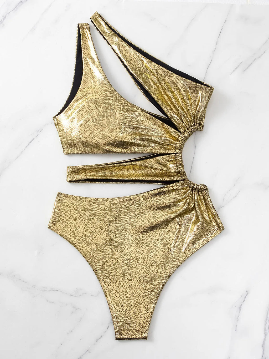 Gold coloured backless one-piece swimsuit for women on a white background.