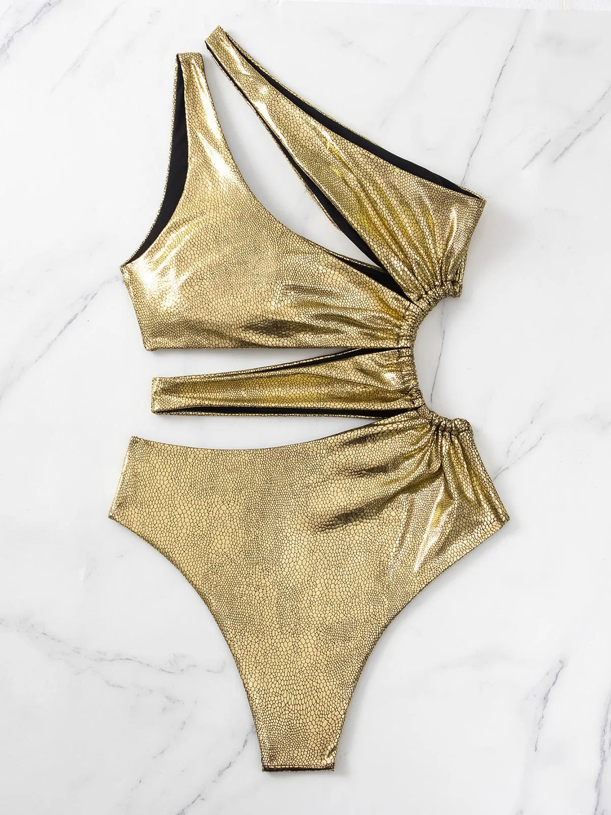 Gold coloured backless one-piece swimsuit for women on a white background.