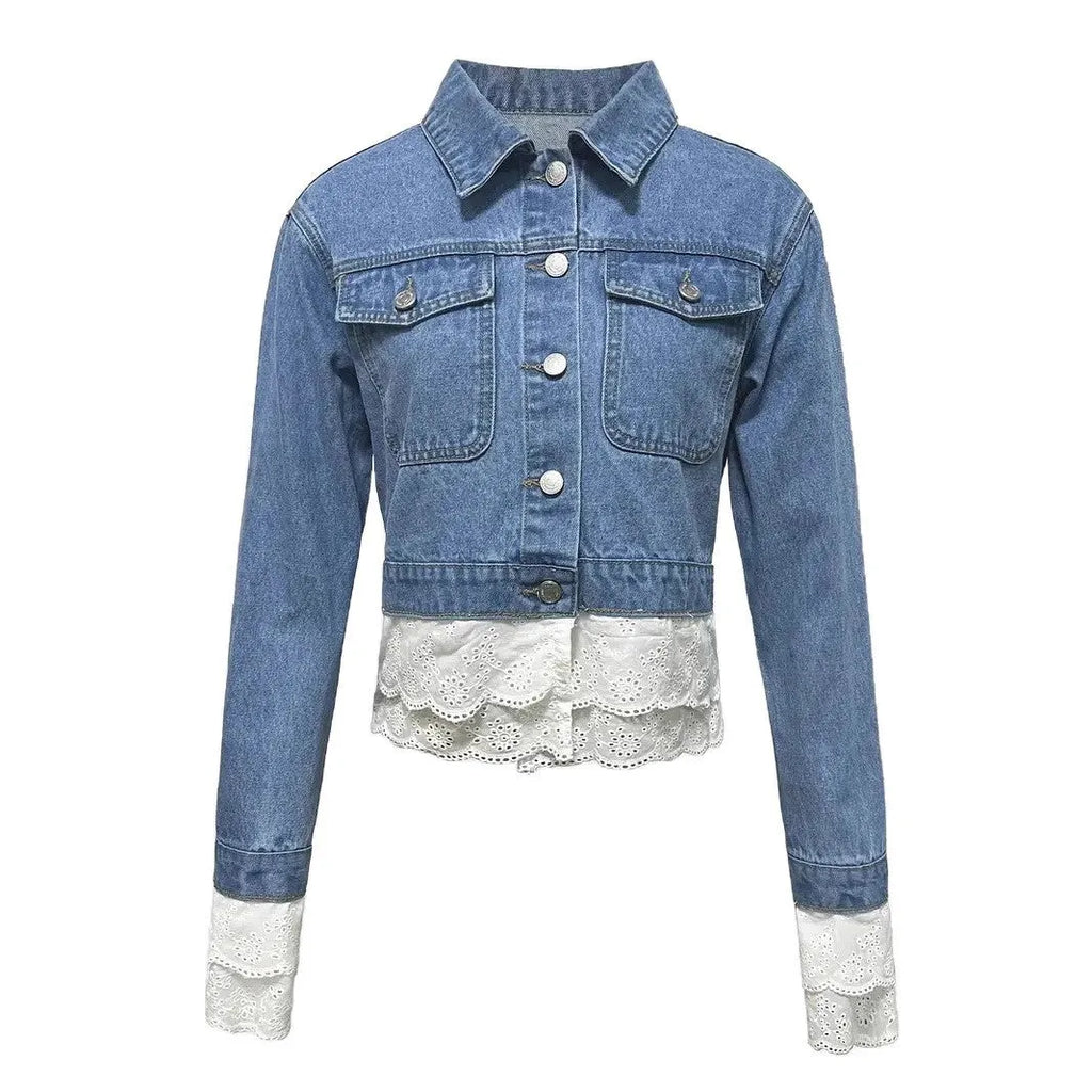 Blue women's denim jacket with lace stitching detail on front, long sleeves, shown on hanger