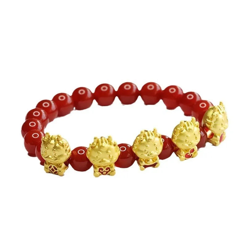 Close-up of a red agate bracelet bead carved with a Chinese Five Blessings Dragon design.