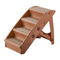 Foldable plastic pet stairs with non-slip surface in beige colour beside a sofa