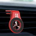 Magnetic car phone holder mounted on vehicle air vent with smartphone attached showing adjustable rotation mechanism