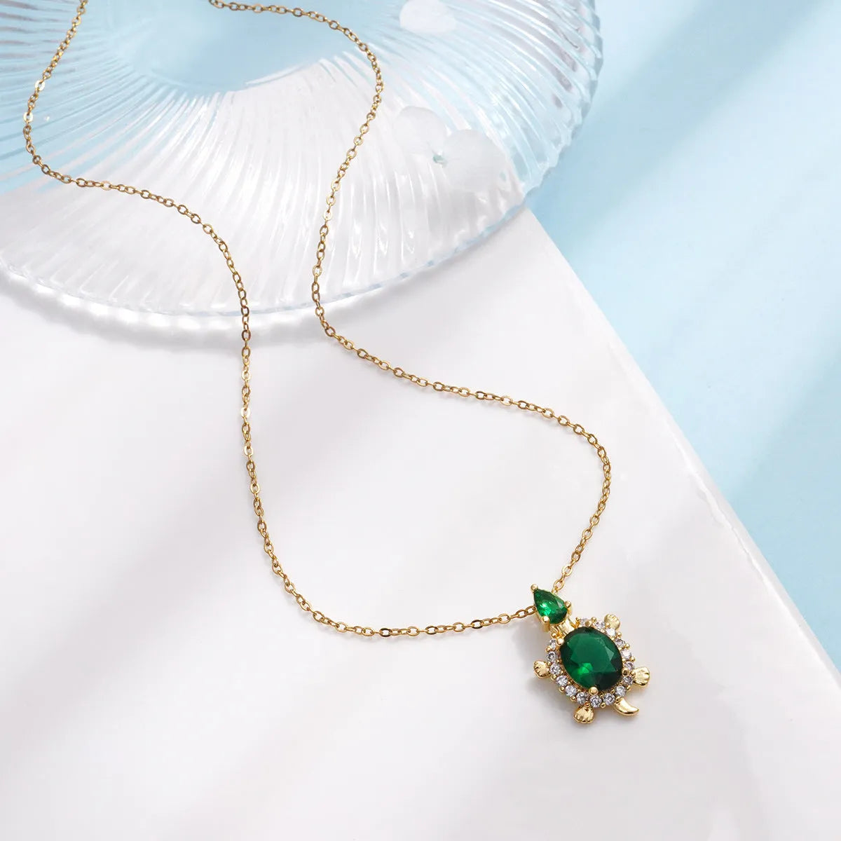 Gold-plated copper sea turtle necklace with zirconium-encrusted inlay on a titanium steel O-link chain