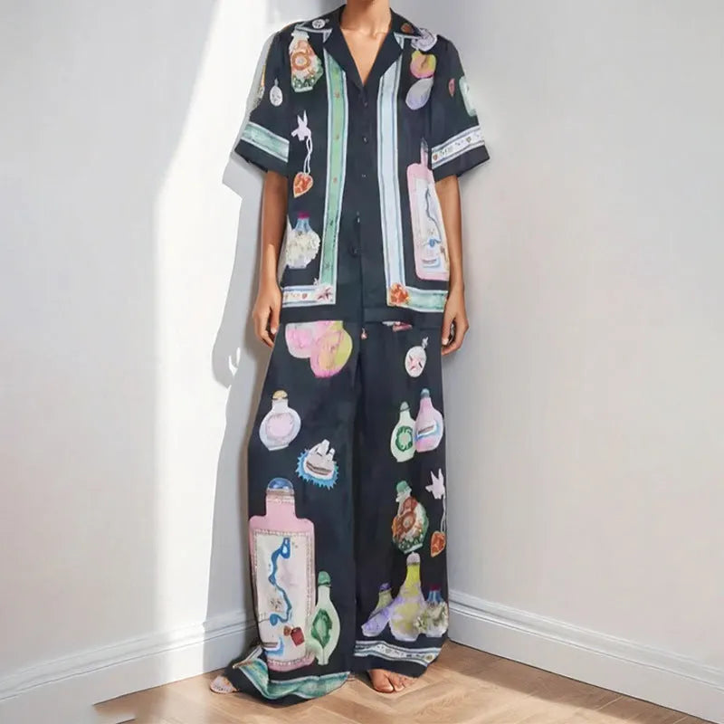 Women's black cardigan set with cartoon pattern, includes top and trousers