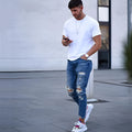 Men's deep blue cotton jeans laid flat, showing button fly and five-pocket design