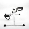 White mini exercise bike with mechanical resistance, non-slip pedals, rubber feet and 150kg maximum load