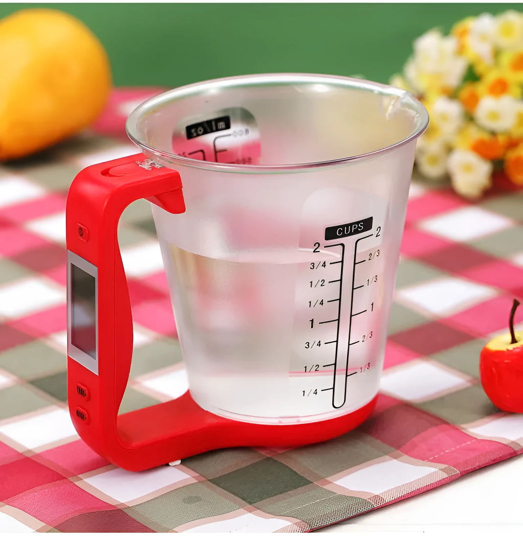 Green digital kitchen measuring cup with integrated LCD display showing weight and temperature measurements
