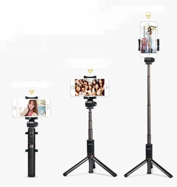 Bluetooth selfie stick tripod with remote control extended with smartphone attached