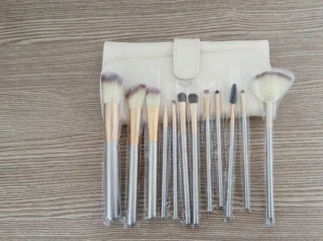 Persian make-up brush set with rice white brush heads and champagne coloured handles, shown in a set.