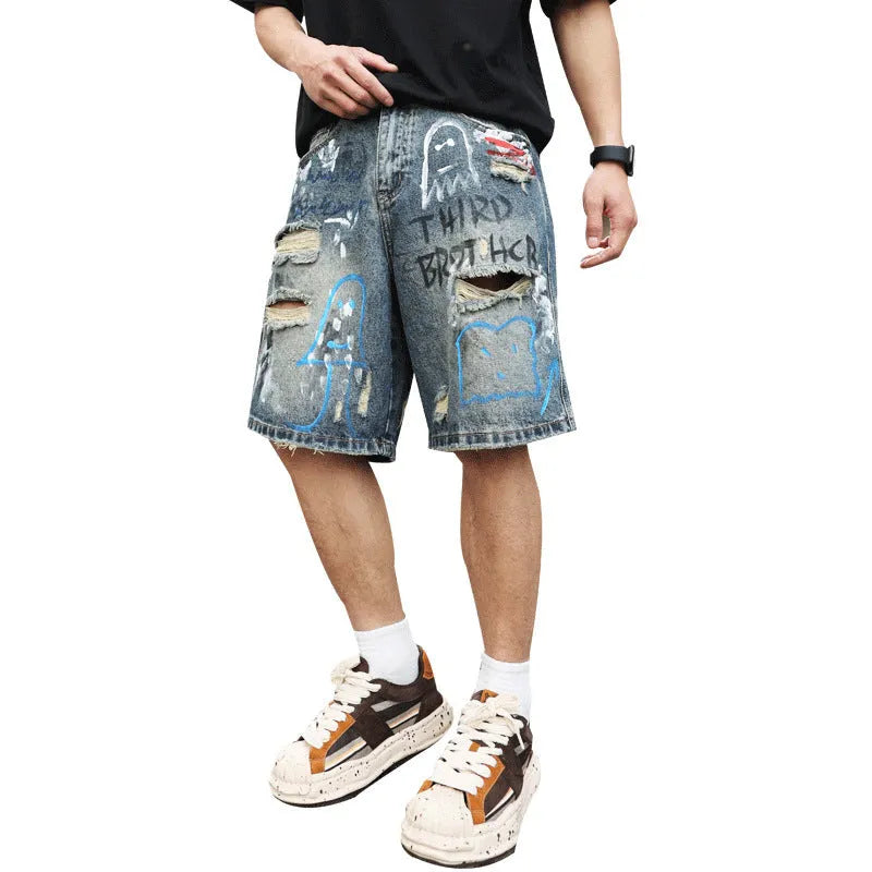 Blue denim shorts for men with ripped knees and graffiti print, featuring a straight leg and a zipper fly