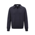 Man wearing a loose black pullover bottoming shirt for casual layered outfit.