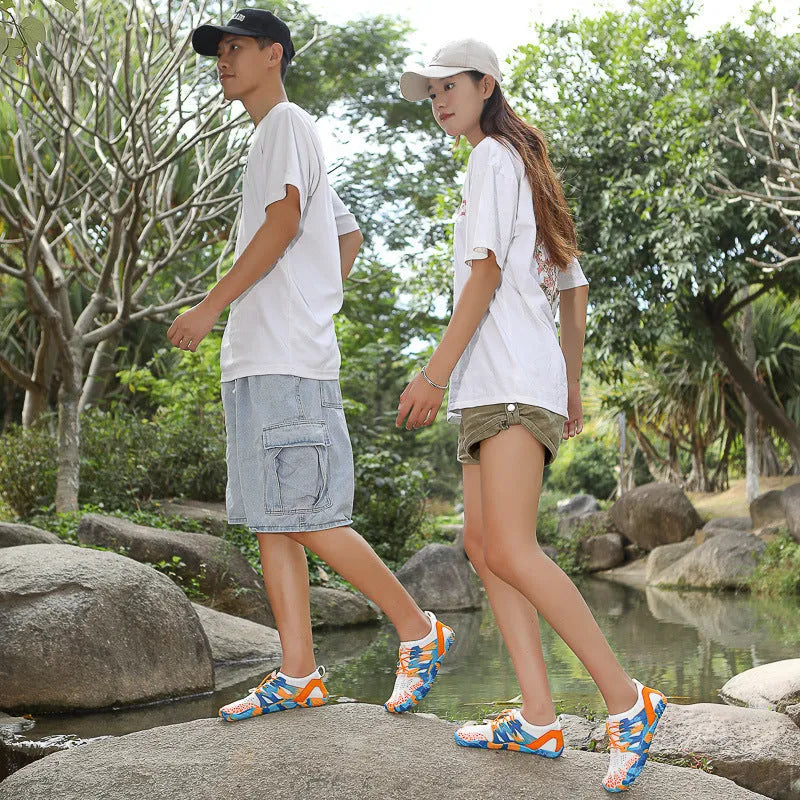 Quick-drying lace-up wading shoes in multiple colours with mesh upper and textured rubber sole.
