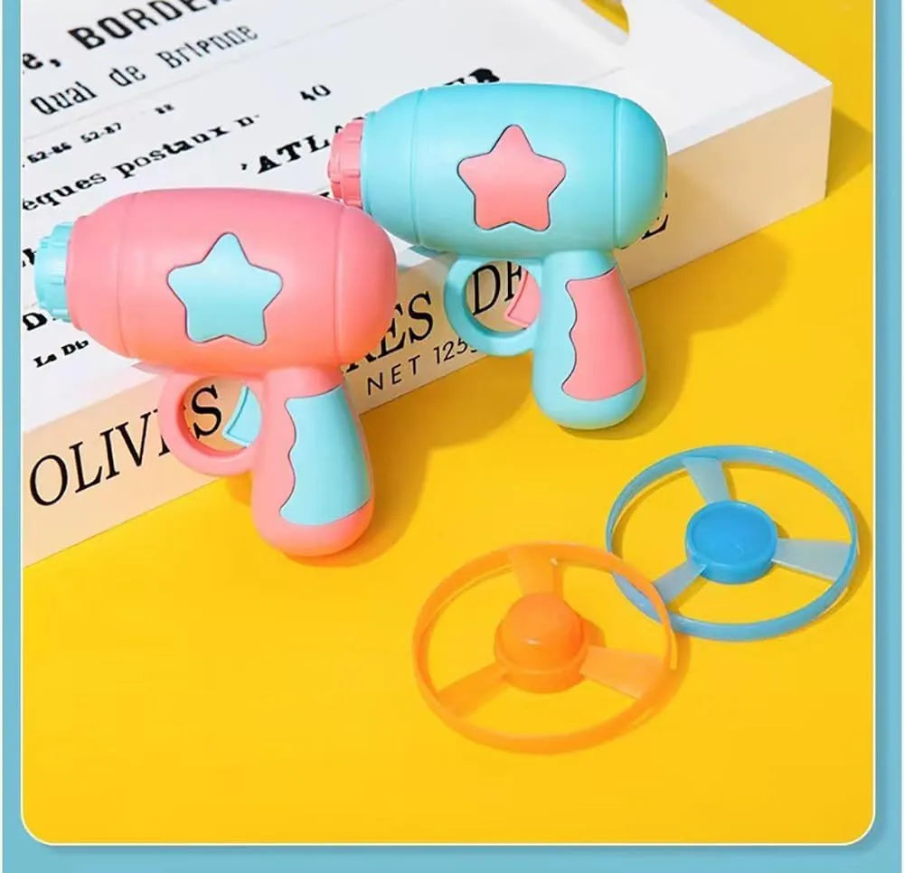 Blue plastic cat toy gun with spinning mechanism and flying disc for indoor feline play