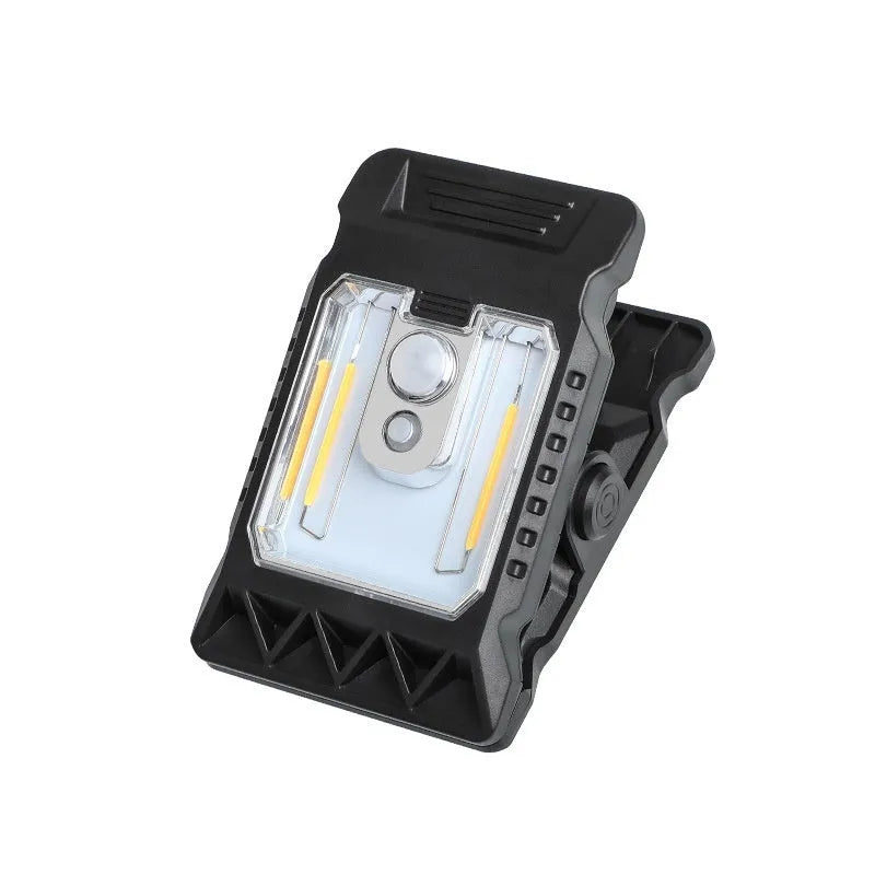 Compact white ABS clip lamp with motion sensor, shown clipped to a shelf edge