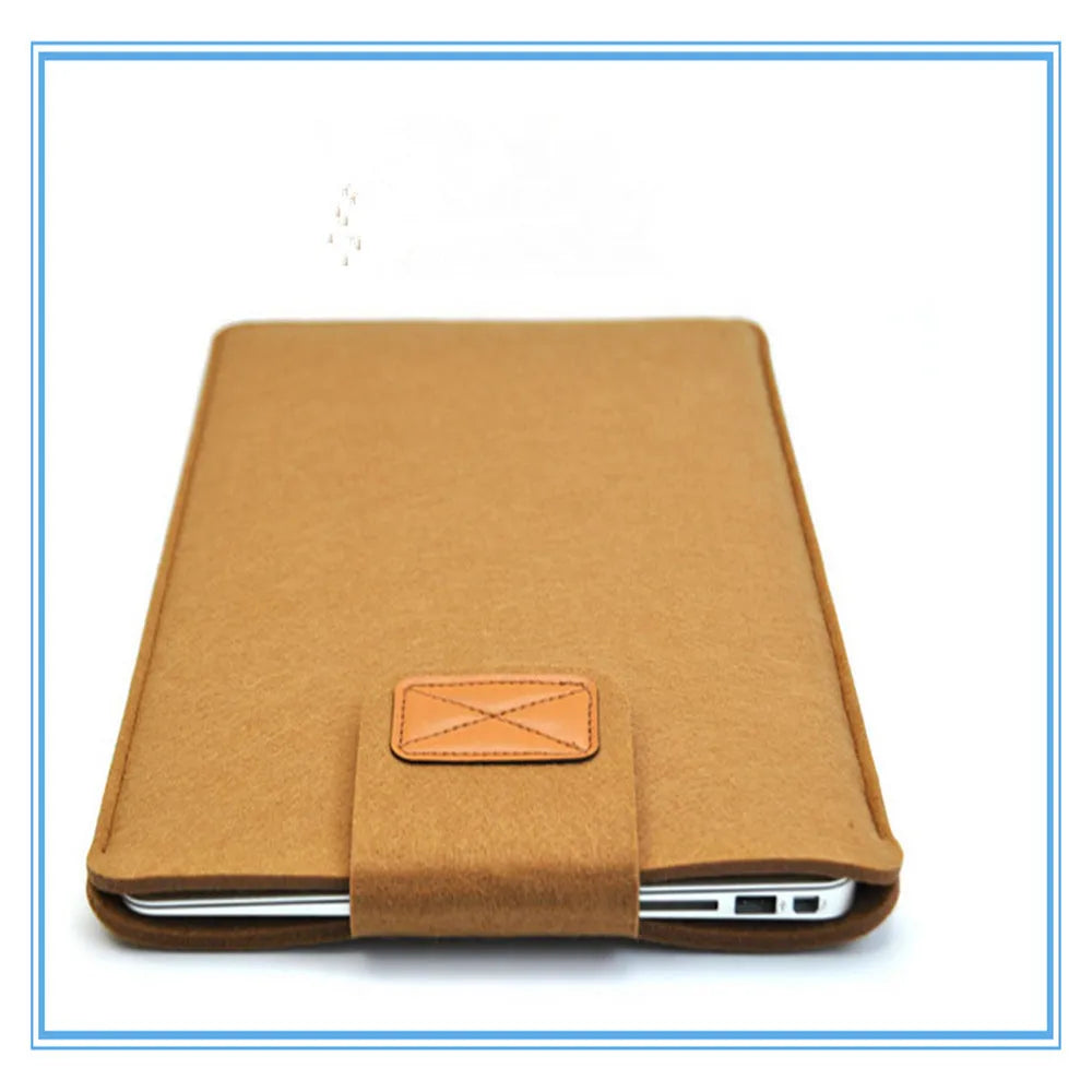 Dark grey felt clamshell laptop bag open to show internal compartment for a tablet