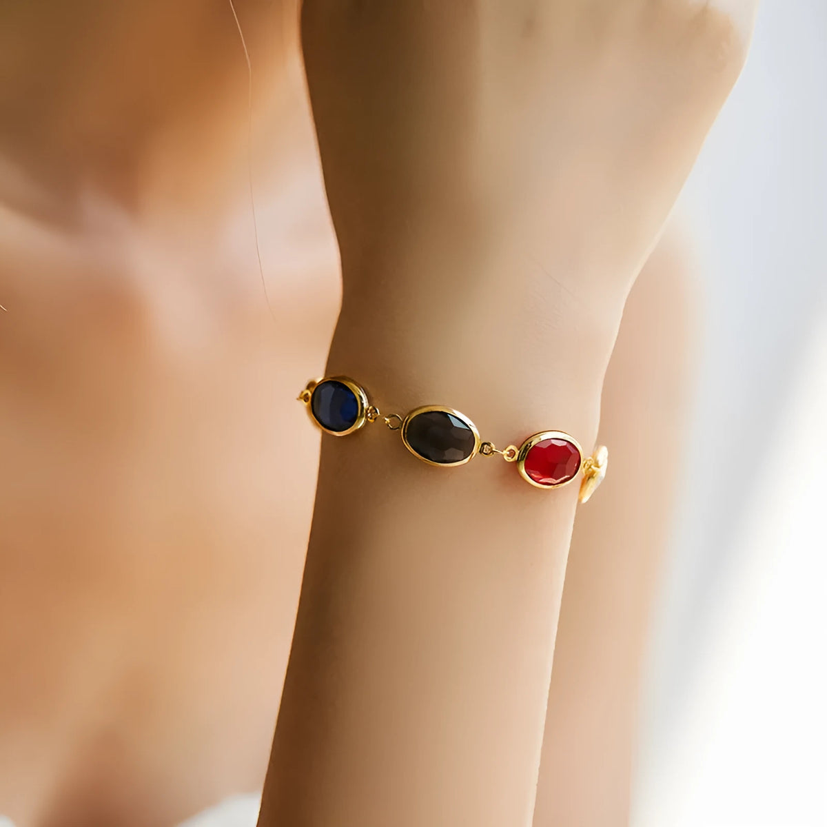 Geometric copper bracelet with glass inlay in blue, green, and multicolor options showing ellipse design elements
