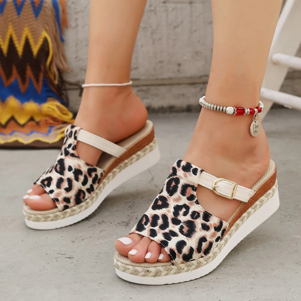 Leopard print wedge heel platform sandals in light green, shown from the side.