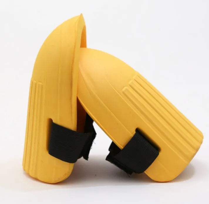 A pair of thick EVA foam knee pads in army green colour, shown on a grey background.