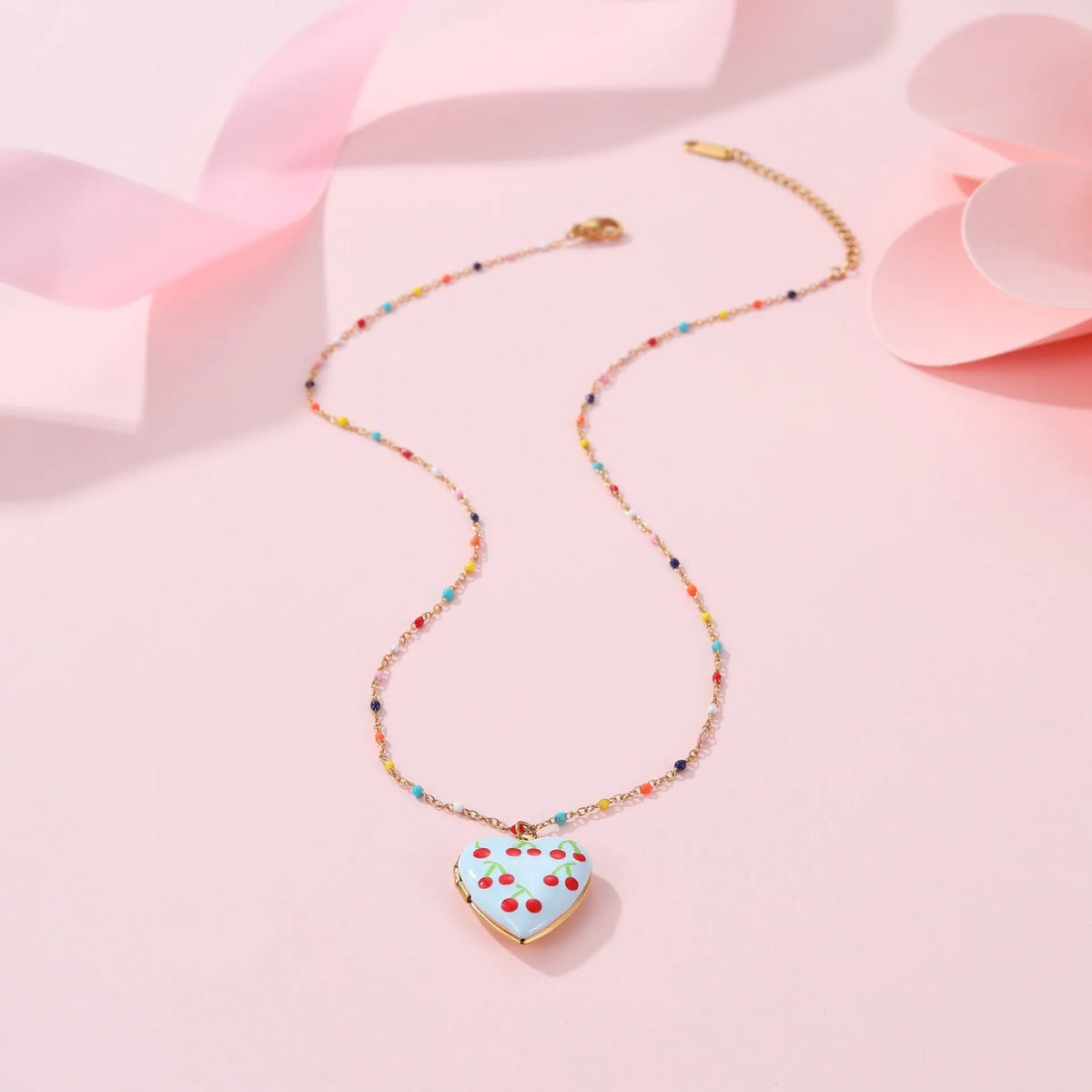 Gold-plated stainless steel necklace with heart-shaped fruit pendant on adjustable chain