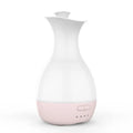 White or pink ceramic ultrasonic air humidifier and essential oil diffuser with colourful night light, 200ml capacity.