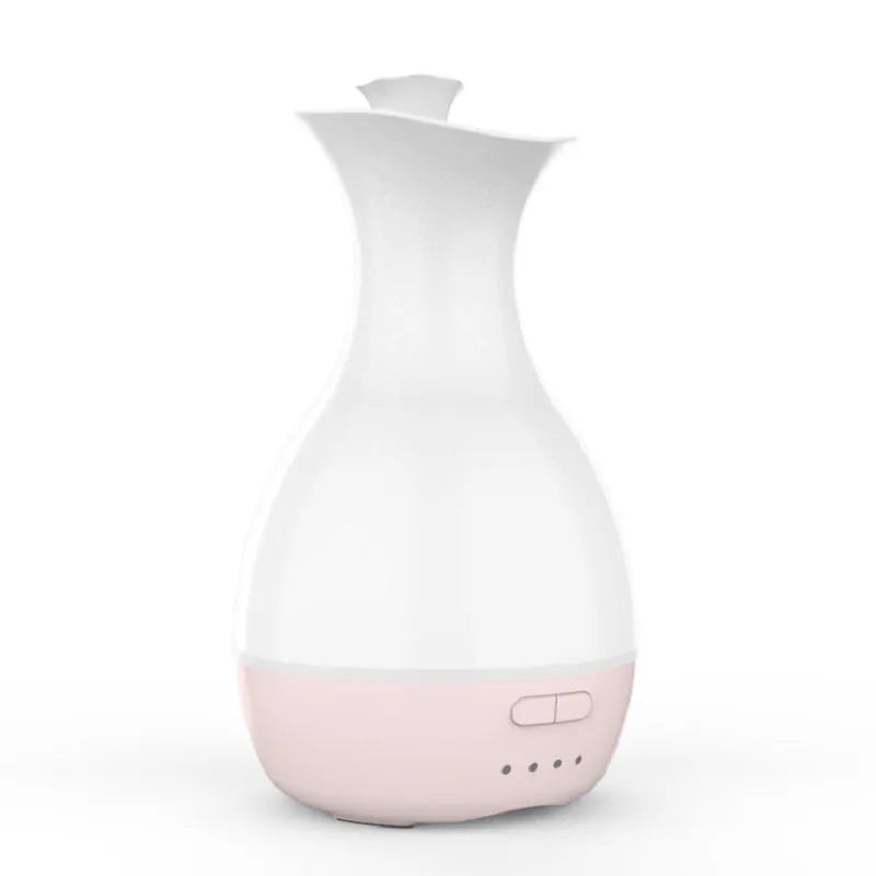 White or pink ceramic ultrasonic air humidifier and essential oil diffuser with colourful night light, 200ml capacity.