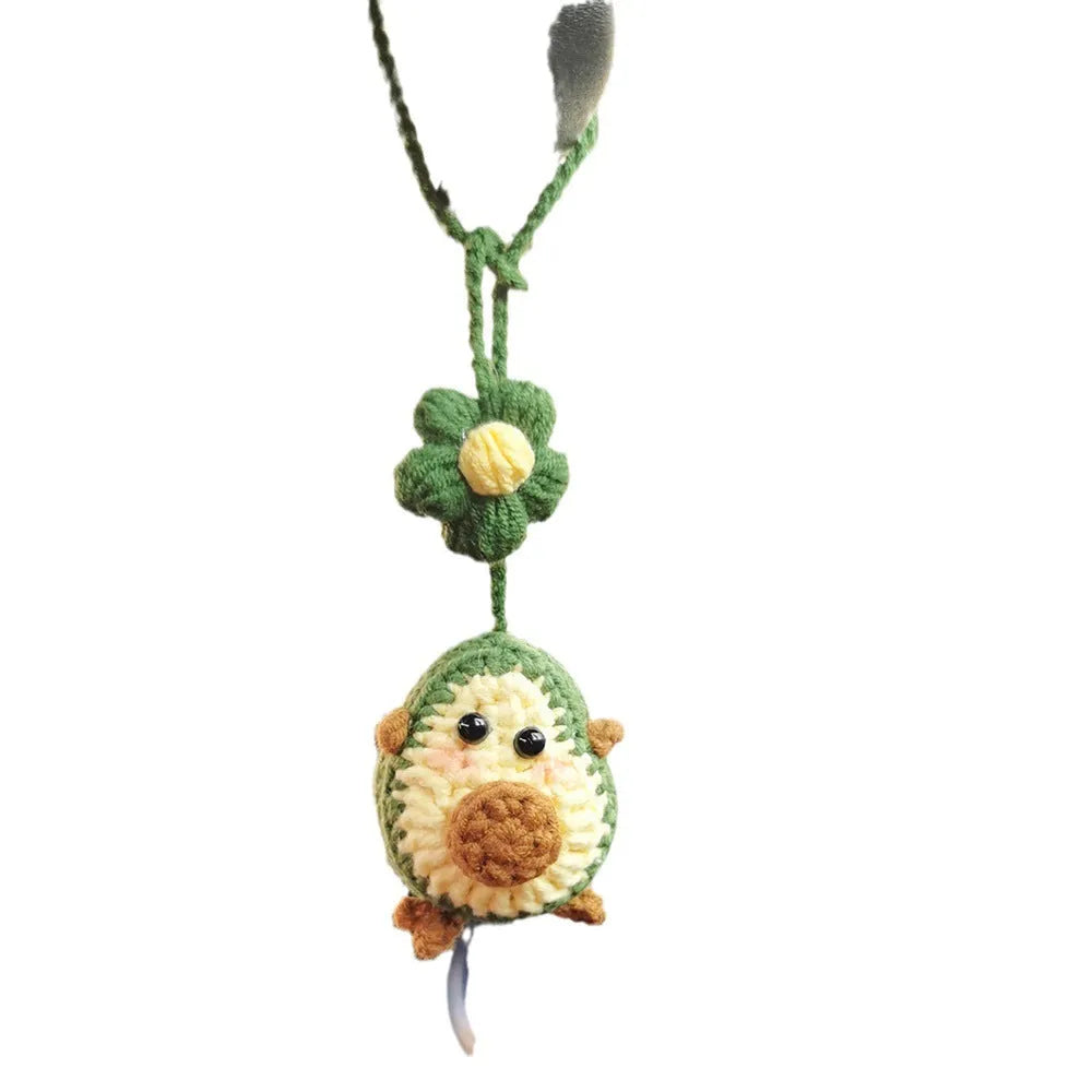 Handmade crocheted wool car pendant in avocado colour with rainbow flower design