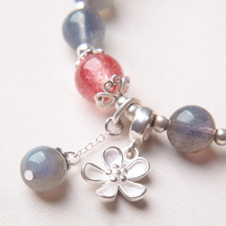 Women's 925 sterling silver bracelet with a grey moonlight stone bead and adjustable clasp.